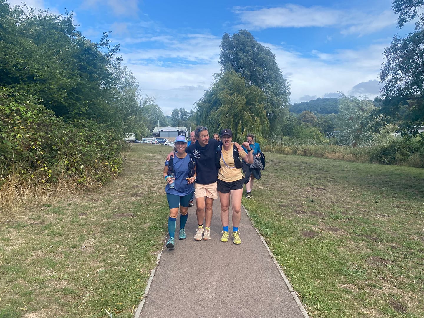 Coach walking along with ultra runners