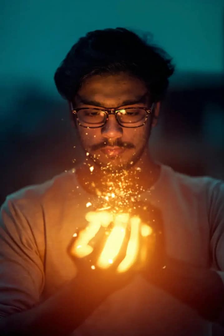man with glowing orb in his hands