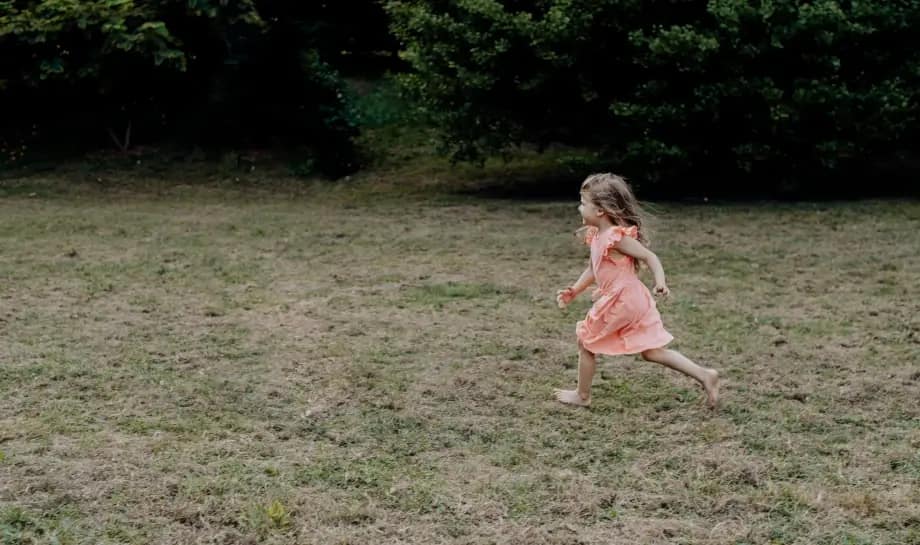 girl running on grass