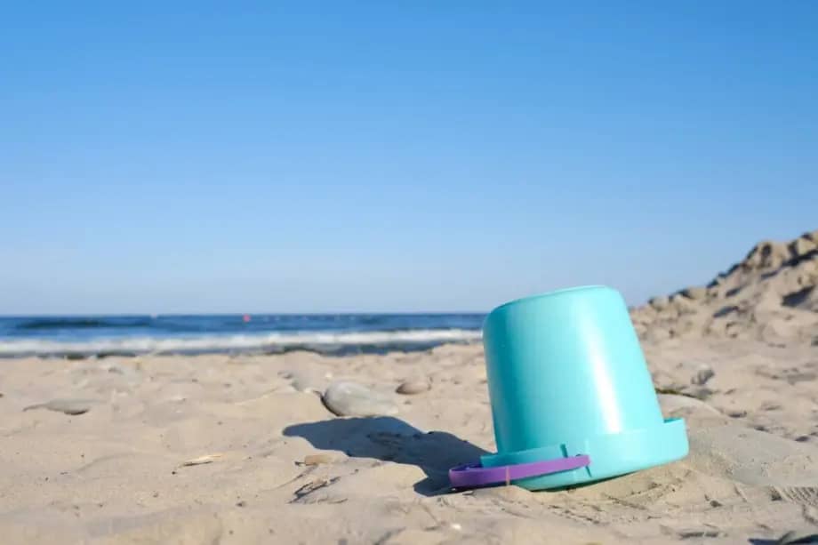 bucket on sand by the beach