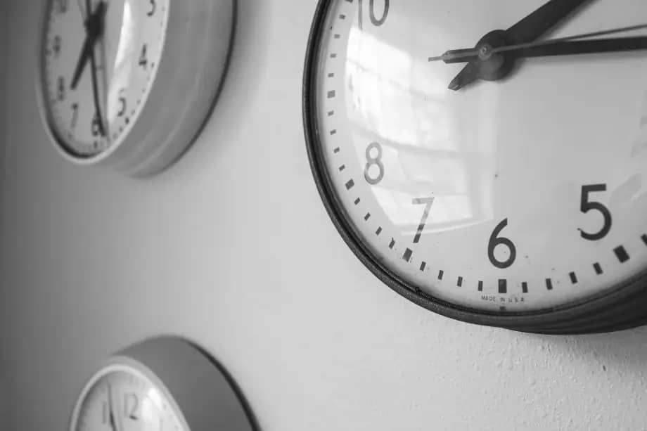 several clocks on a wall