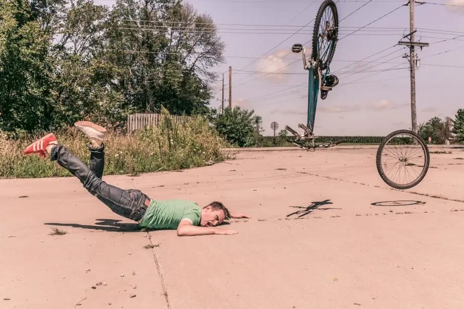 man falling off a bike