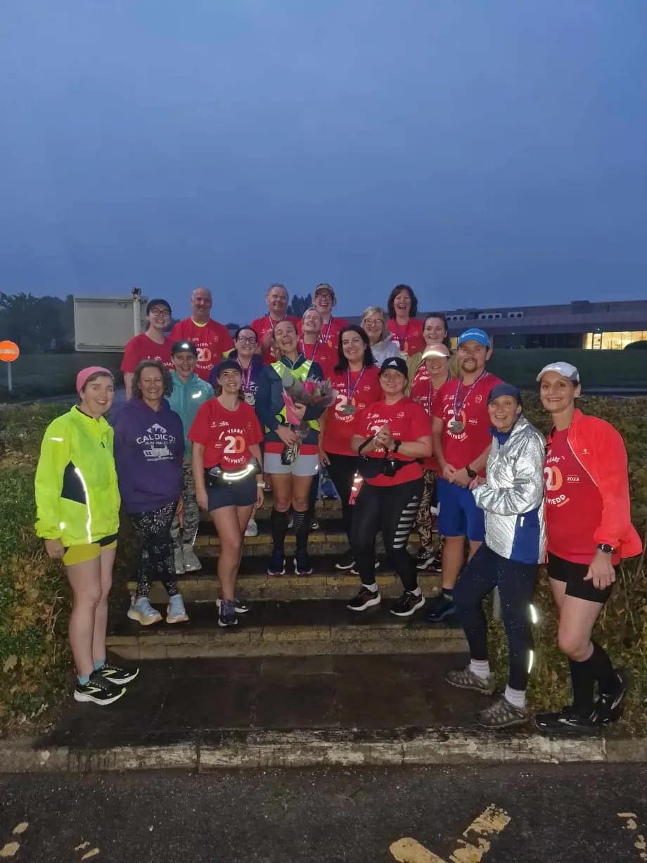 team of runners with awards