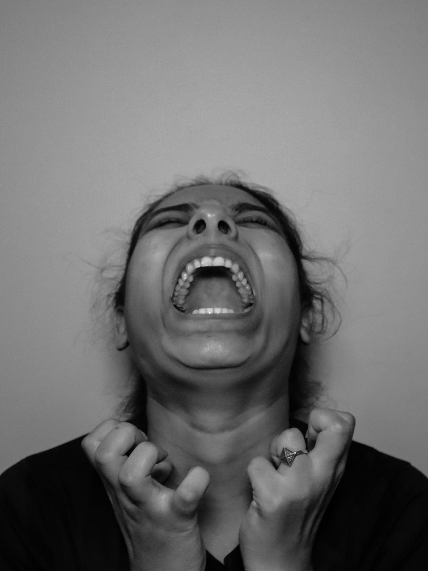 Woman screaming with mouth open