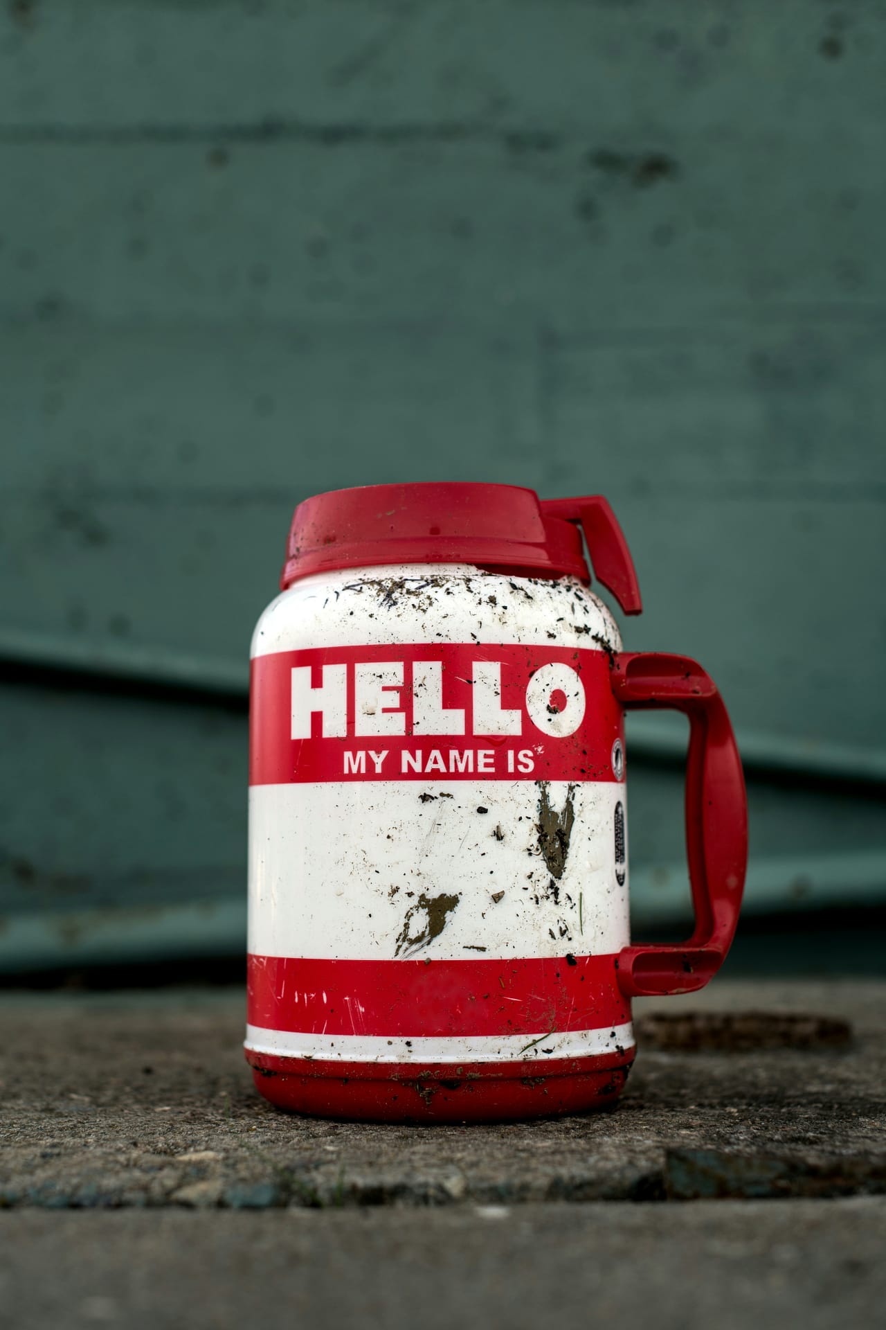 red and white pitcher with hello my name is [blank] on