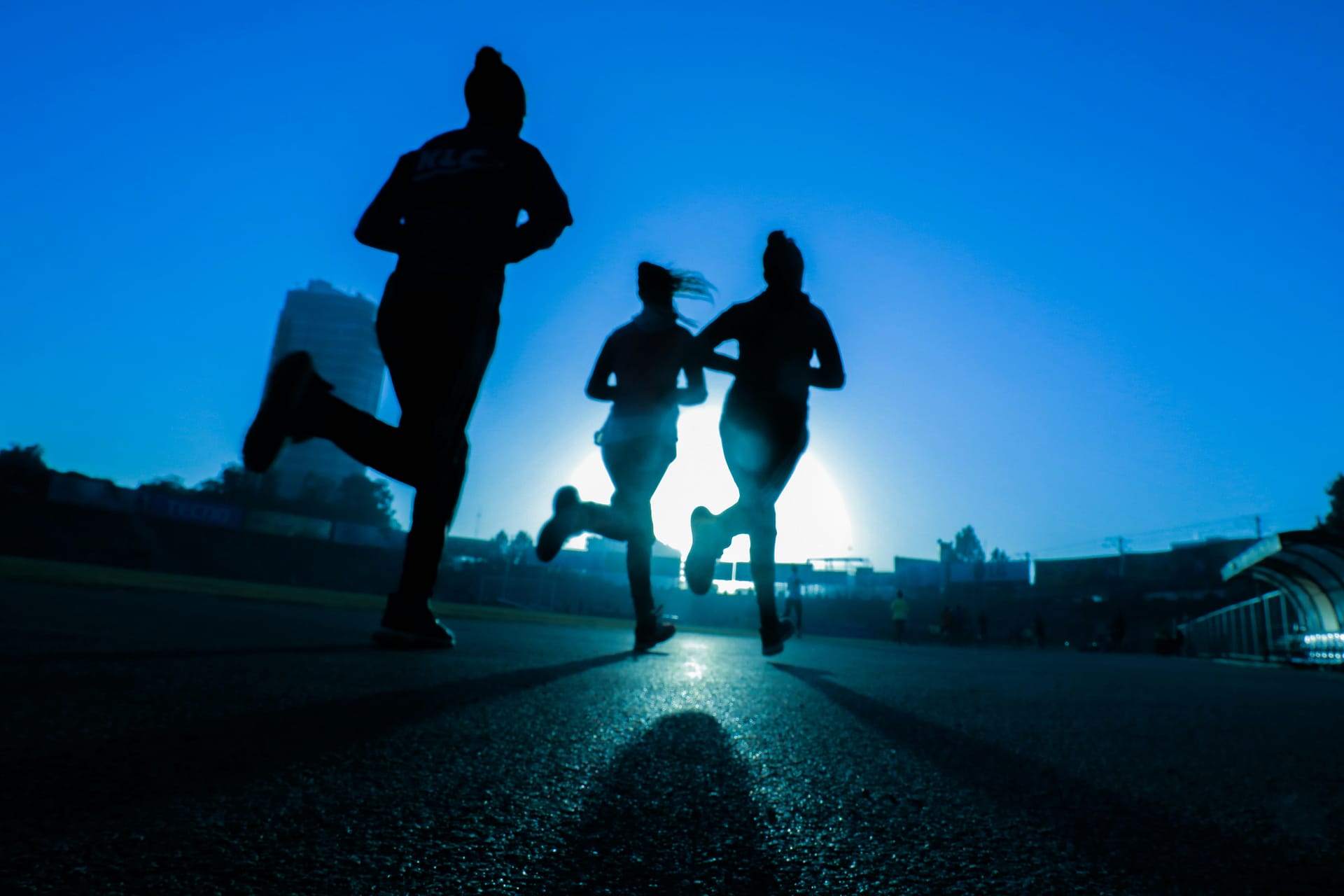 Women running at night with moon light